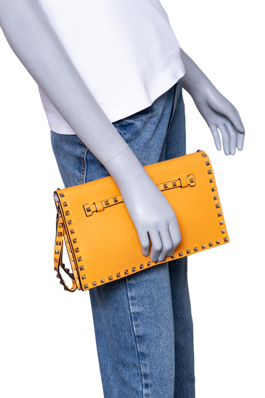 VALENTINO ROCKSTUD WRISTLET CLUTCH MUSTARD
