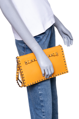 VALENTINO ROCKSTUD WRISTLET CLUTCH MUSTARD