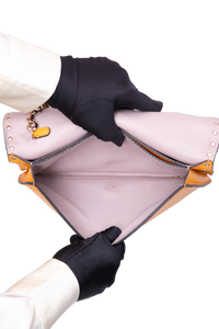 VALENTINO ROCKSTUD WRISTLET CLUTCH MUSTARD