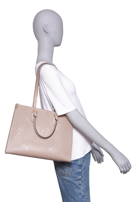 LV ON THE GO MM MONOGRAM EMPREINTE TAUPE