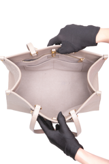 LV ON THE GO MM MONOGRAM EMPREINTE TAUPE