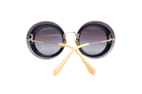 MIU MIU ROUND METAL GOLD TONE/GREY GRADIENT